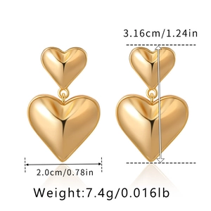Detailed view of gold heart drop earrings with precise dimensions and weight measurements