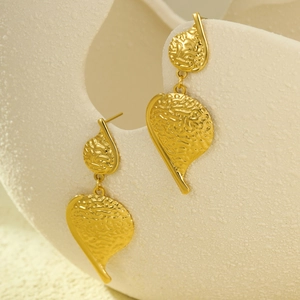 Fashionable golden irregular drop earrings with textured leaf design for women