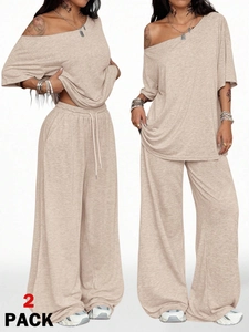 Detail showing oatmeal knit lounge set texture with 2-pack text and wide-leg drape