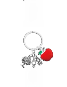 Detail view of engraved teacher gift keychain with apple, tree, and owl charms