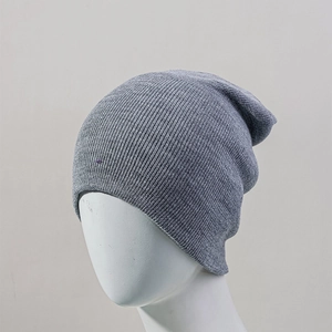 Detail of grey slouchy beanie on mannequin showing fine knit texture and soft fabric