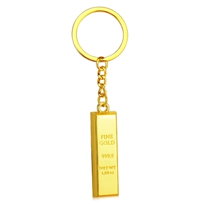 Golden fine gold bar keychain with 999.9 purity engraving on high-shine metal surface