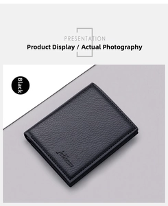 Macro detail of men's slim vertical wallet showing black lychee grain leather texture