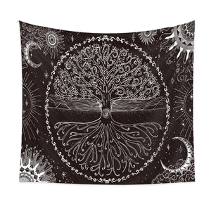 Detail of bohemian black and white tapestry showing Tree of Life and celestial moon pattern