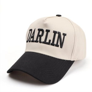 Close-up of the DARLIN black embroidery and cotton twill fabric on the baseball cap
