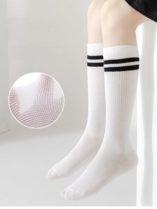 Detailed macro view of white breathable mesh texture on kids knee high sports socks