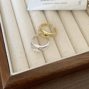 Detailed macro view of S925 sterling silver adjustable rings in gold and silver finish