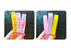 Close-up of colorful silicone keychain lanyards with Happy print and rainbow patterns