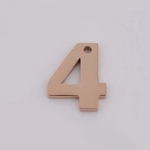 Close-up of rose gold stainless steel number 4 pendant for DIY jewelry making