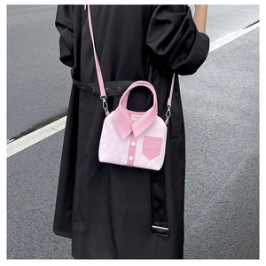 Detail of pink and white crossbody bag featuring unique shirt collar and button design