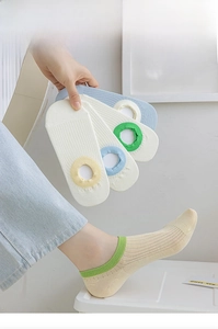 Close-up of ribbed cotton no-show socks with non-slip silicone edge and pastel colors