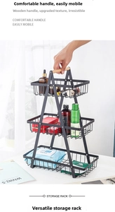 Detail view of a 3-tier black metal fruit basket featuring a smooth wooden handle grip