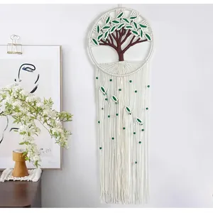 Detailed handmade macrame tree of life wall hanging with cotton rope and green leaves