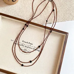 Elegant retro Maillard style layered beaded necklace featuring black heart crystal accents