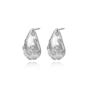 Detailed view of silver teardrop earrings with heart-shaped crystal pavé accents