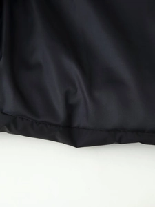 Macro view of black high-density polyester fabric texture and fine stitching detail