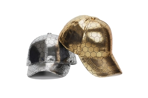 Detail of gold and silver baseball caps with metallic finish and hexagonal mesh texture