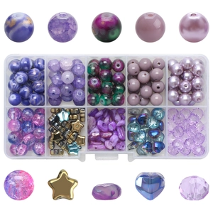Flat lay of purple and blue cracked glass beads in 10-compartment storage box for DIY jewelry