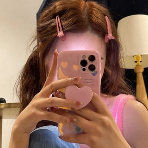 Pink phone case with a heart-shaped folding air cushion stand and stylish heart patterns