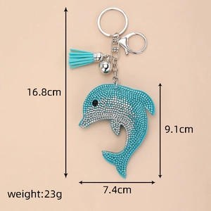 Detailed view of rhinestone dolphin keychain with dimensions 16.8cm and tassel charm