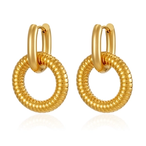 Detail of 18K gold plated stainless steel textured hoop earrings on white background