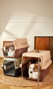 Detail of portable pet travel crates showing metal mesh doors and secure locking latches