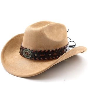 Detail of vintage camel suede cowboy hat with turquoise buckle and leather studded band