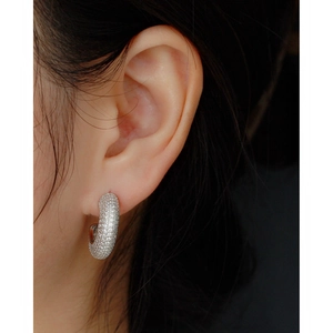 Sparkling silver hoop earring with pavé setting on model, 925 sterling silver style