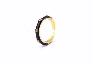 Detailed close-up of 18K gold plated ring featuring black enamel and sparkling zircons