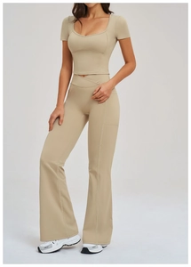 Detail of sand beige yoga set with U-neck crop top and crossover waist flared leggings