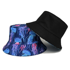 Reversible jellyfish print bucket hat in navy blue and plain black sun protection cap