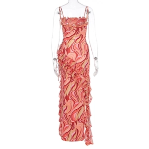Detail of vibrant swirl print summer maxi dress with asymmetric ruffled hem and straps
