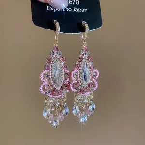 Sparkling pink beaded drop earrings with crystal tassels and micro-pave diamond ear hooks