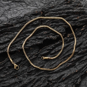Minimalist 2mm gold stainless steel box chain necklace with lobster clasp on dark background