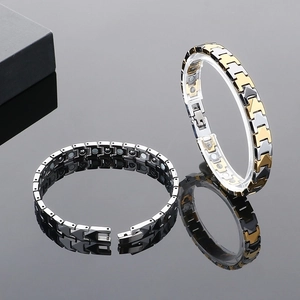 Magnetic therapy stainless steel bracelet with gold, silver, and black links for men and women