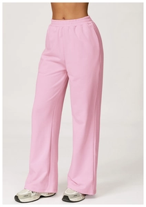 Detail of pink high-waisted wide-leg sweatpants with vertical seam and elastic waistband
