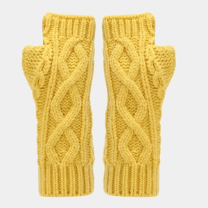 Close-up detail of yellow cable knit fingerless gloves showing warm textured yarn material