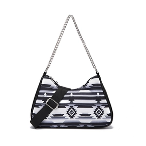 Detail of Aztec bohemian crossbody bag with black and white geometric print and chain
