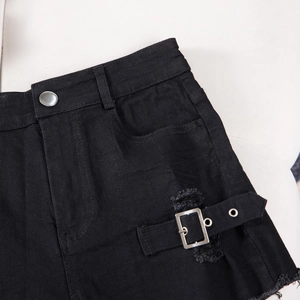 Detail of high waisted black denim shorts with silver button and side metal buckles