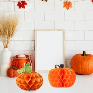 Set of two orange honeycomb paper pumpkins for Thanksgiving and autumn party decor