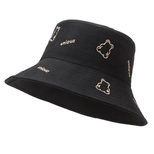Detail view of black cotton bucket hat featuring unique bear embroidery and fine stitching