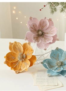 Detailed texture of 24cm flocked velvet magnolia flower with gold glitter accents