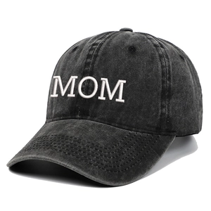 Close-up of MOM embroidery and stitching details on a washed dark grey baseball cap