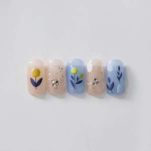 Floral press-on nails set with pink and blue matte base, flower patterns and rhinestones