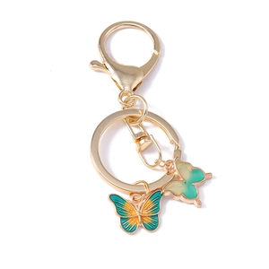 Golden butterfly keychain with gradient enamel pendants and swivel clasp on white background