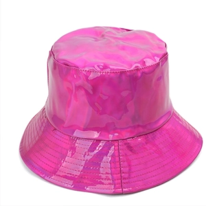 Detail of bright pink bucket hat with glossy laser-reflective PU leather and stitched brim