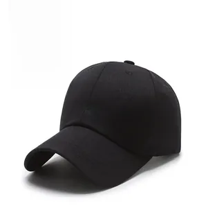Detail of black baseball cap featuring white tmi cursive embroidery on cotton twill
