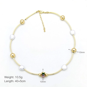 Detail view of pearl necklace with gold beads and multi-color gemstone pendant