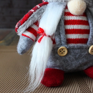 Christmas gnome doll with red and white striped knit shirt and long white beard
