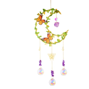 Golden crescent moon suncatcher with artificial green leaves, butterflies and purple crystals